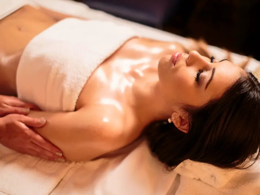 Photo of a woman enjoying a massage with oil