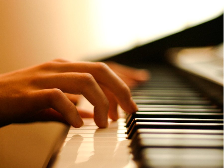 Photo of someone playing the piano