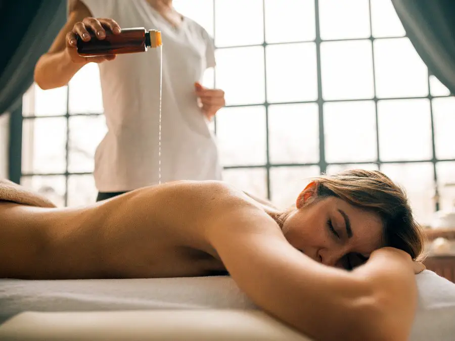 Photo of a woman taking a massage with oil on a bed